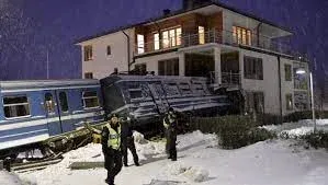 Train crash into building